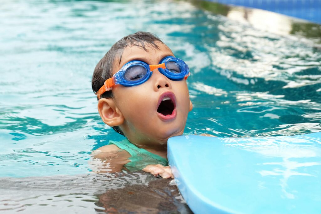 NavaAquatics Boy swimming in the pool during swimming lesson